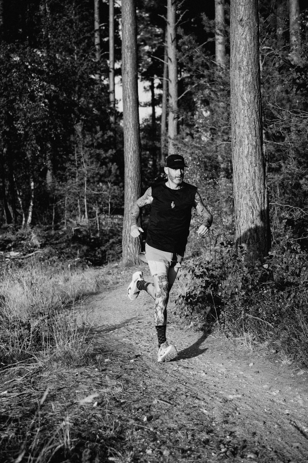 Oliver running along a woodland trail, photographed by Sam Hodges